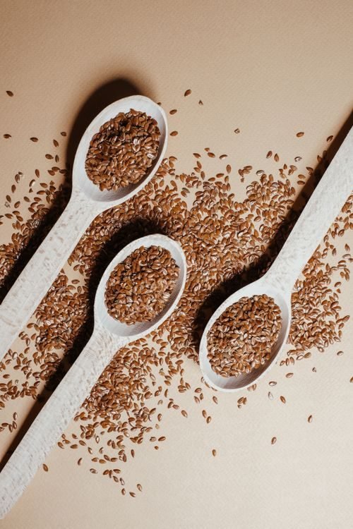 Flax seeds on wooden spoons