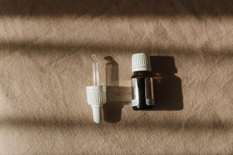 Essential oil bottle on a clean cloth, no people