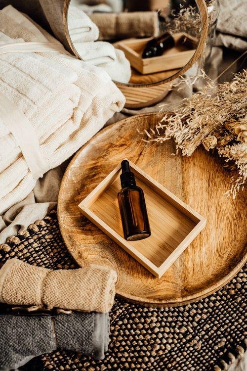 Unbranded amber essential oil bottle on a tray